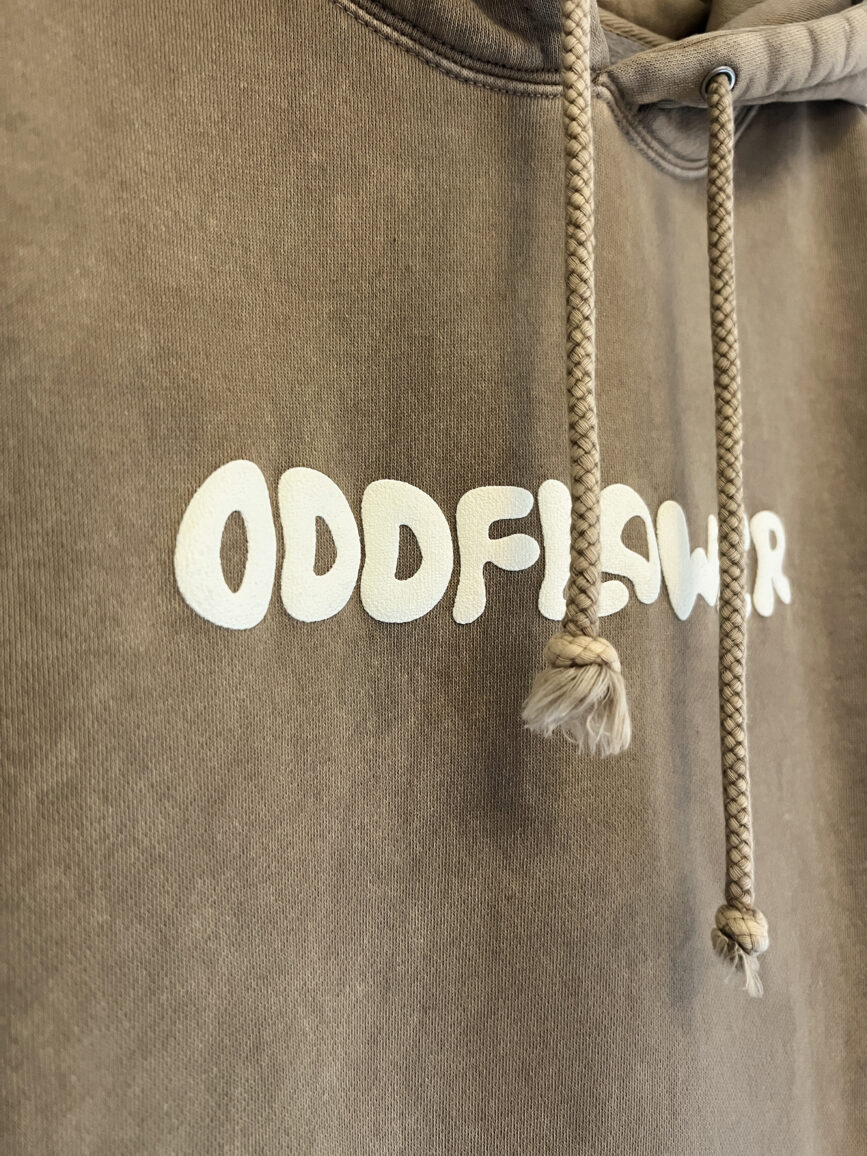 Close up of Oddflower logo puff print